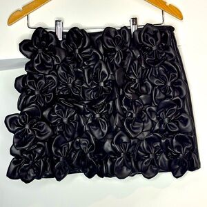 Vegan leather skirt with handmade bow detail